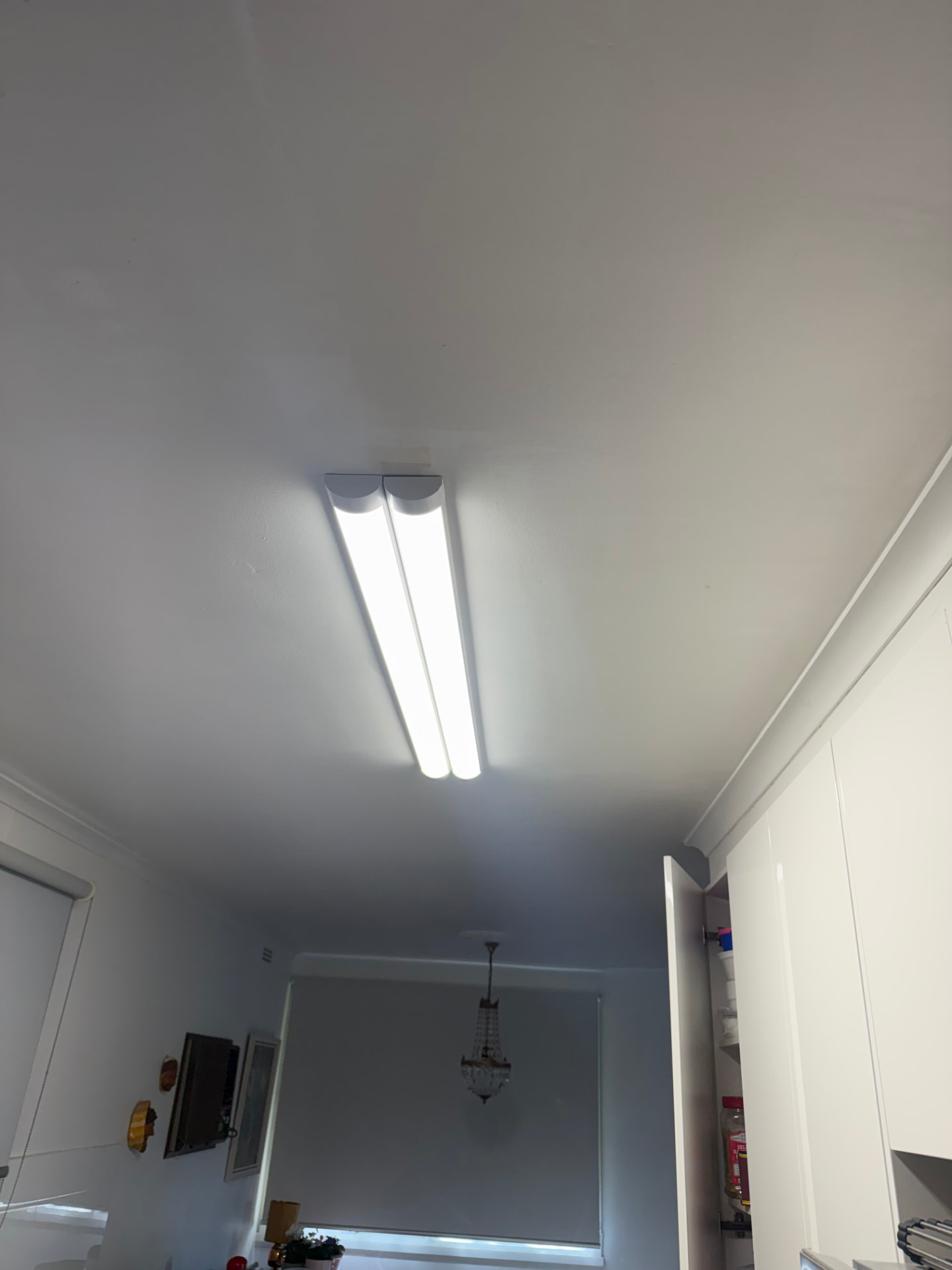 Bright LED batten light fitted to a kitchen ceiling